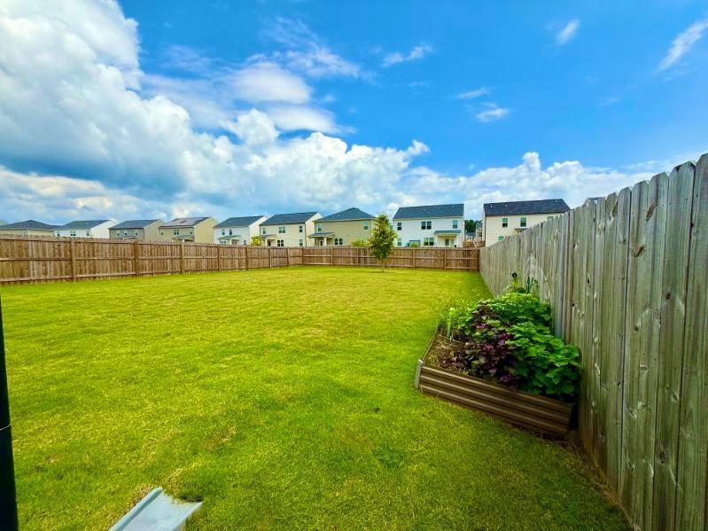 2015 Waycross Lane Dacula, GA 30019 - Photo 45 of 49 a view of a fountain in front of house with a yard