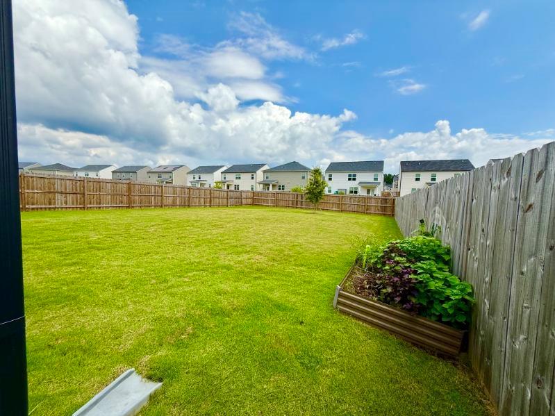 2015 Waycross Lane Dacula, GA 30019 - Photo 46 of 49 a view of a large pool with lawn chairs under an umbrella