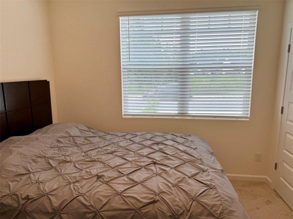 2015 Waycross Lane Dacula, GA 30019 - Photo 10 of 49 a bedroom with a bed and a window