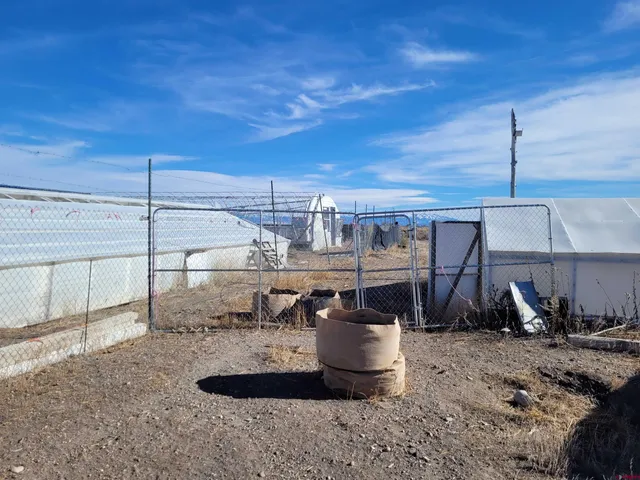 a view of a room with table and chairs
