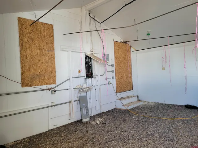 a view of a elevator with chair and door