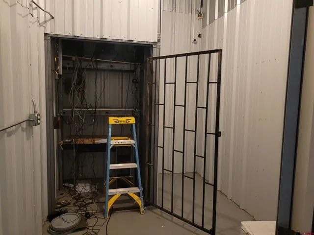 a view of a kitchen with kitchen island granite countertop lots of counter top space