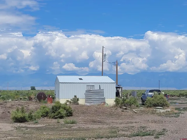 a view of a big house with a big yard