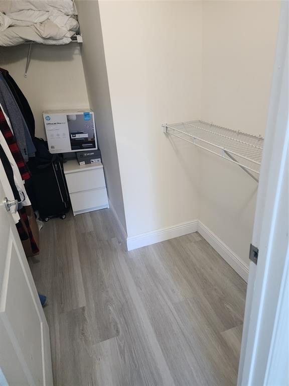 5880 West Sample Road, Unit 206 Coral Springs, FL 33067 - Photo 11 of 34 a view of a hardwood floor in an empty room