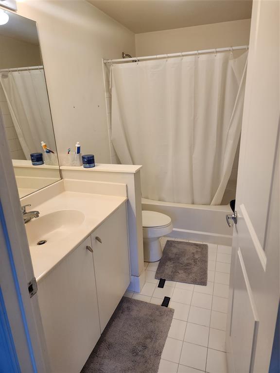 5880 West Sample Road, Unit 206 Coral Springs, FL 33067 - Photo 13 of 34 a bathroom with a sink a toilet and shower