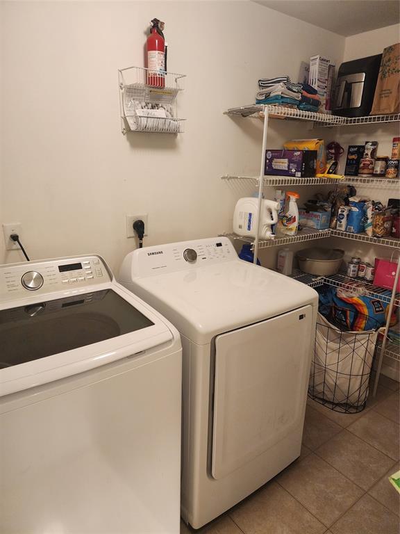 5880 West Sample Road, Unit 206 Coral Springs, FL 33067 - Photo 21 of 34 a utility room with dryer and washer