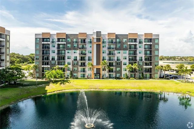 a view of a lake with tall buildings