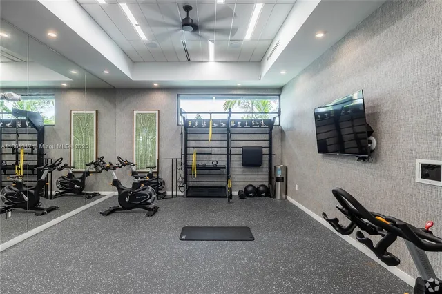 a room with gym equipment and a large window