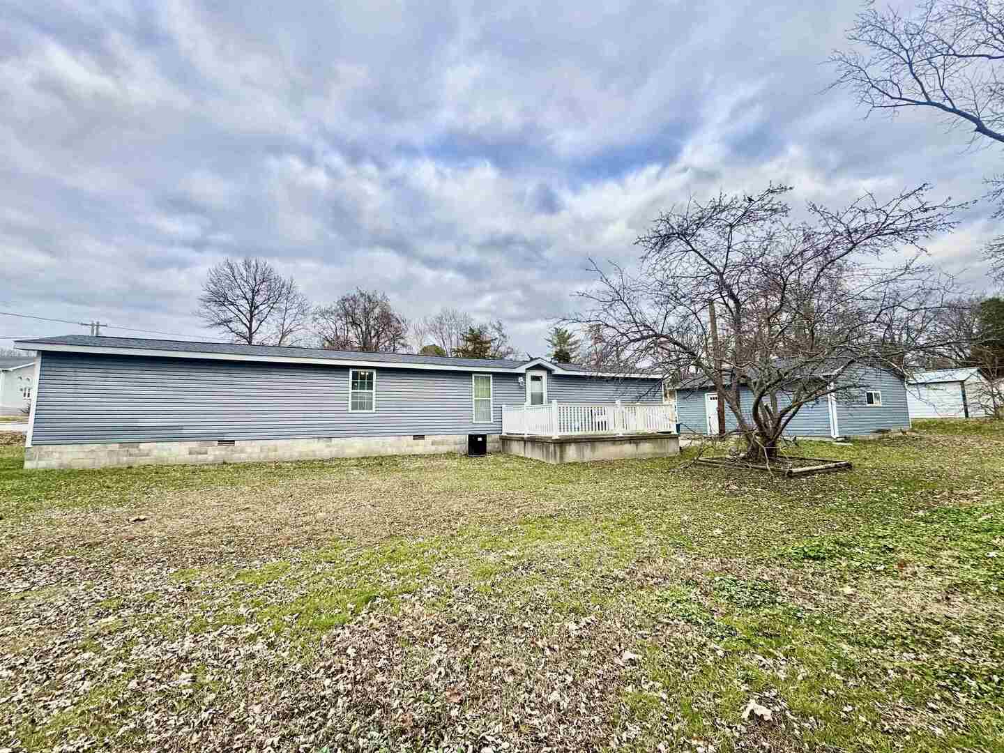 414 West Taylor Street Benton, IL 62812 - Photo 11 of 11 a view of a large yard with a tree