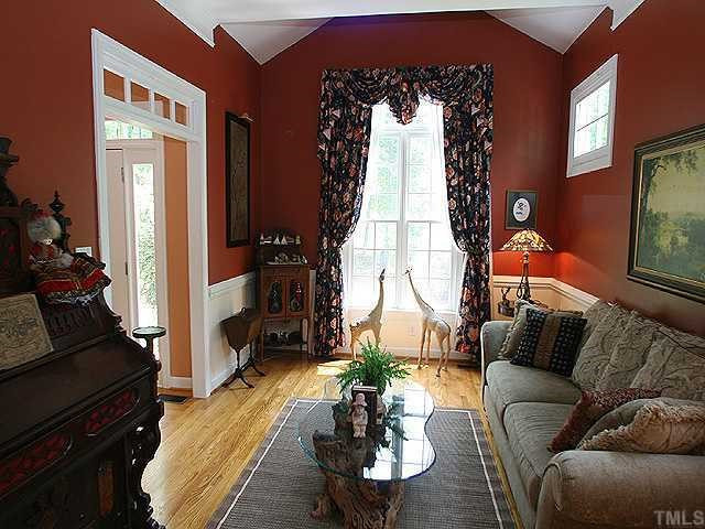 2332 Primrose Valley Court Raleigh, NC 27613 - Photo 3 of 12 The formal living room features a door with a transom window, 1/2 cathedral ceiling, crown molding, and an impressive window overlooking the front yard. Living Room