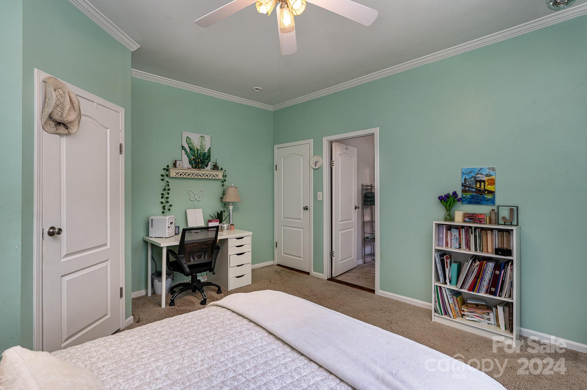 1403 Trinity Church Road Monroe, NC 28112 - Photo 16 of 28 a bedroom with furniture and a book shelf