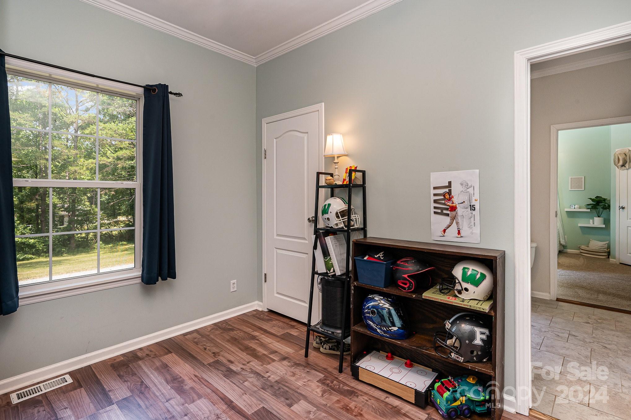 1403 Trinity Church Road Monroe, NC 28112 - Photo 23 of 28 a living room with lots of furniture and a window