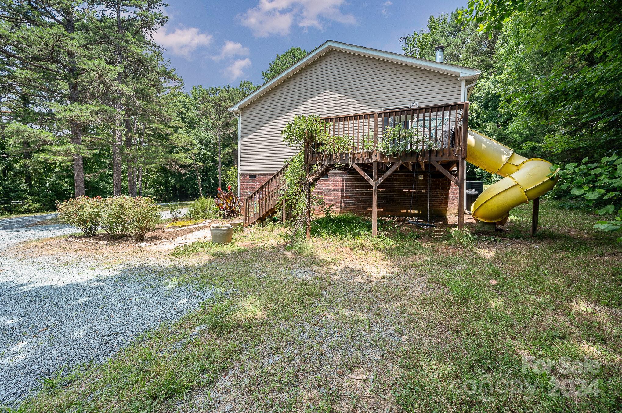 1403 Trinity Church Road Monroe, NC 28112 - Photo 27 of 28 a view of a house with yard and a garden