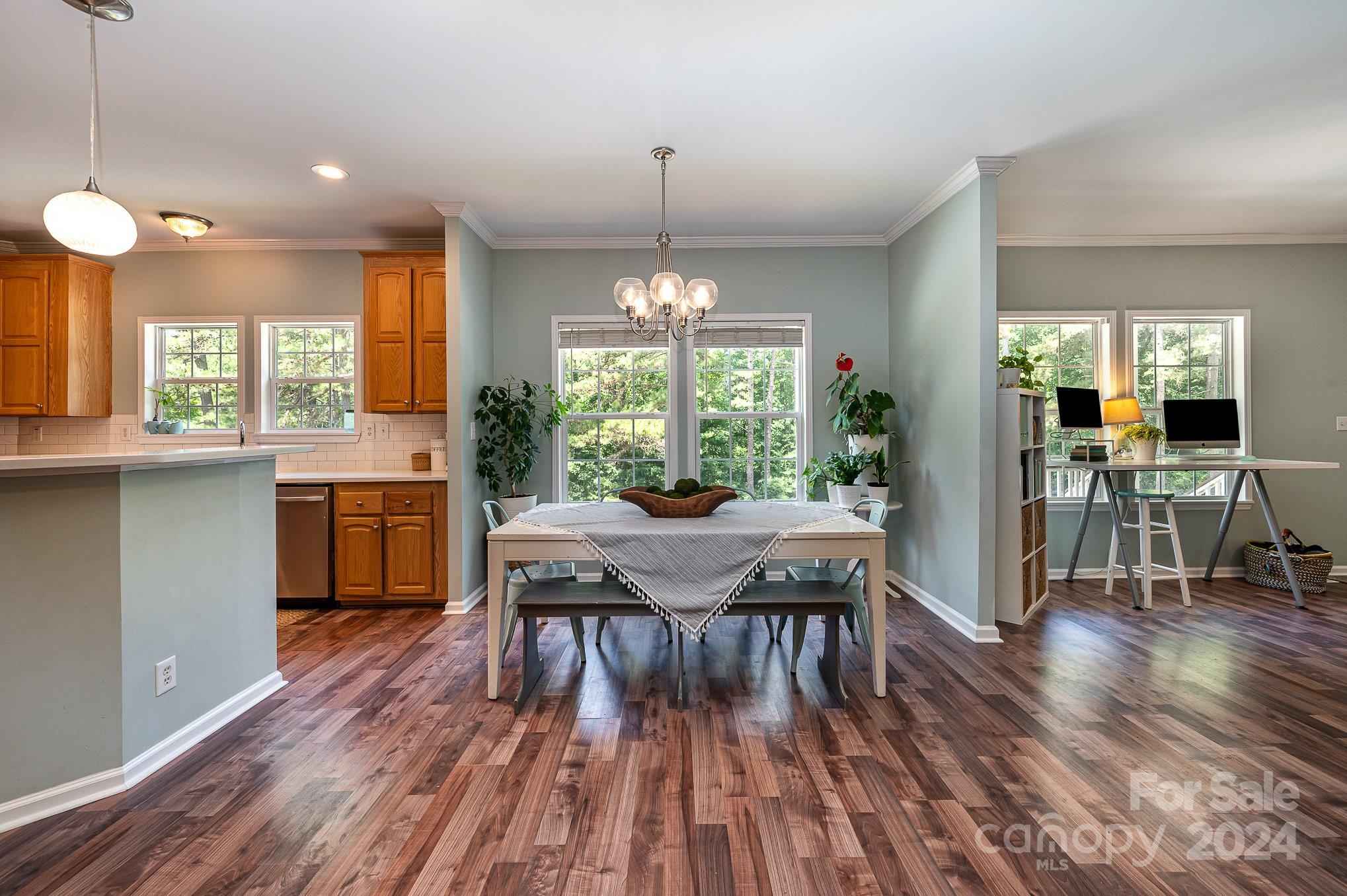 1403 Trinity Church Road Monroe, NC 28112 - Photo 8 of 28 a view of a dining room with furniture window and wooden floor