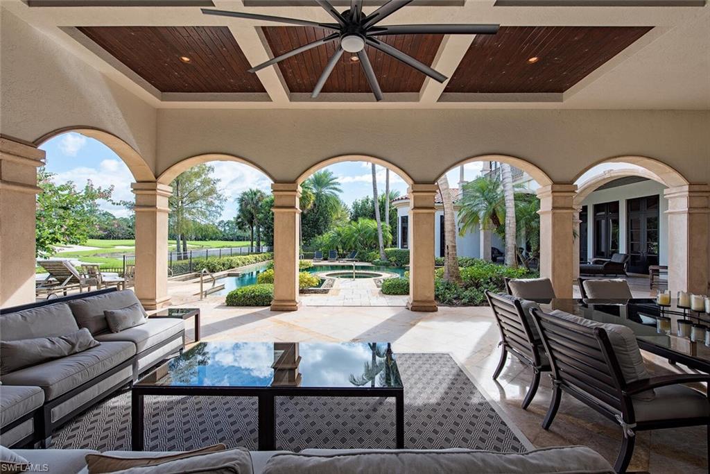 17016 Treviso Way Naples, FL 34110 - Photo 18 of 35 a living room with furniture and a large window
