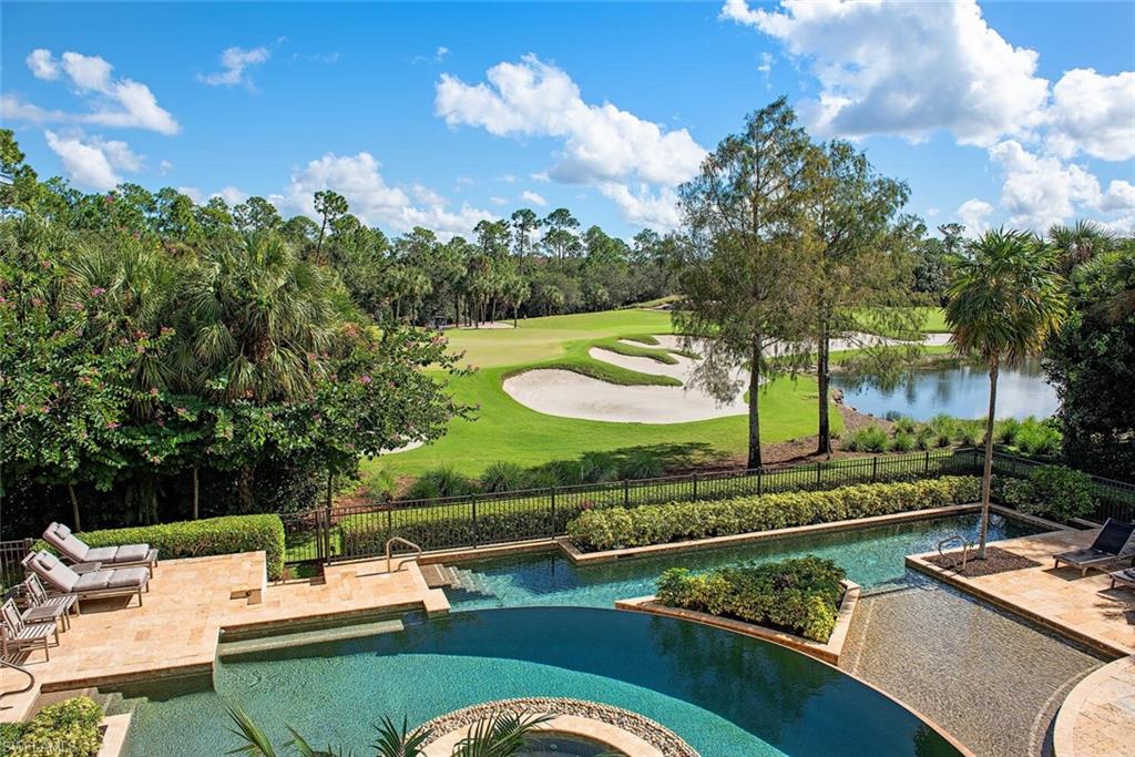 17016 Treviso Way Naples, FL 34110 - Photo 19 of 35 a view of a swimming pool with a patio