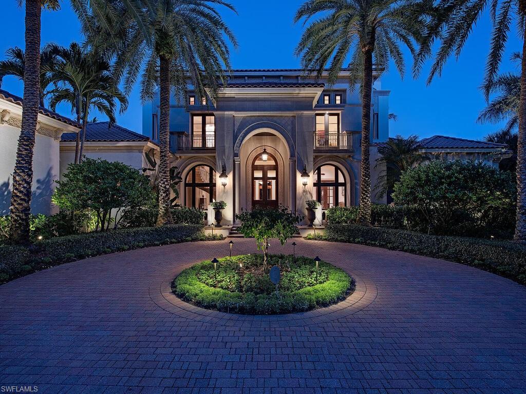 17016 Treviso Way Naples, FL 34110 - Photo 22 of 35 a front view of a house with garden