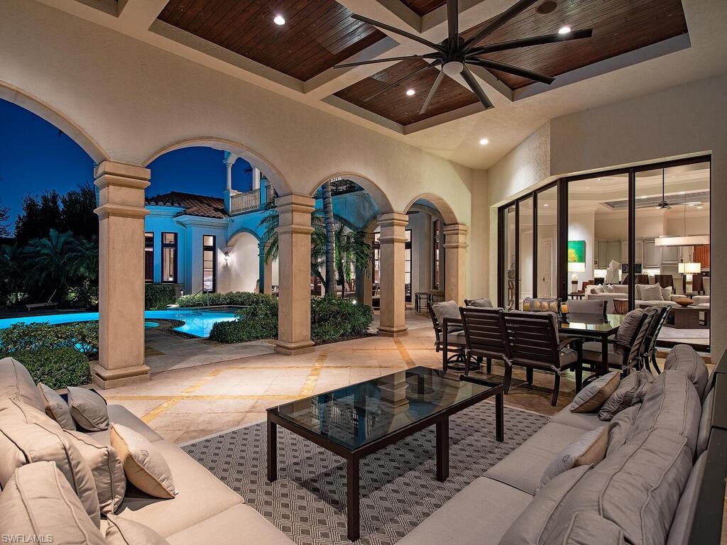 17016 Treviso Way Naples, FL 34110 - Photo 23 of 35 a outdoor space with lots of tables and chairs