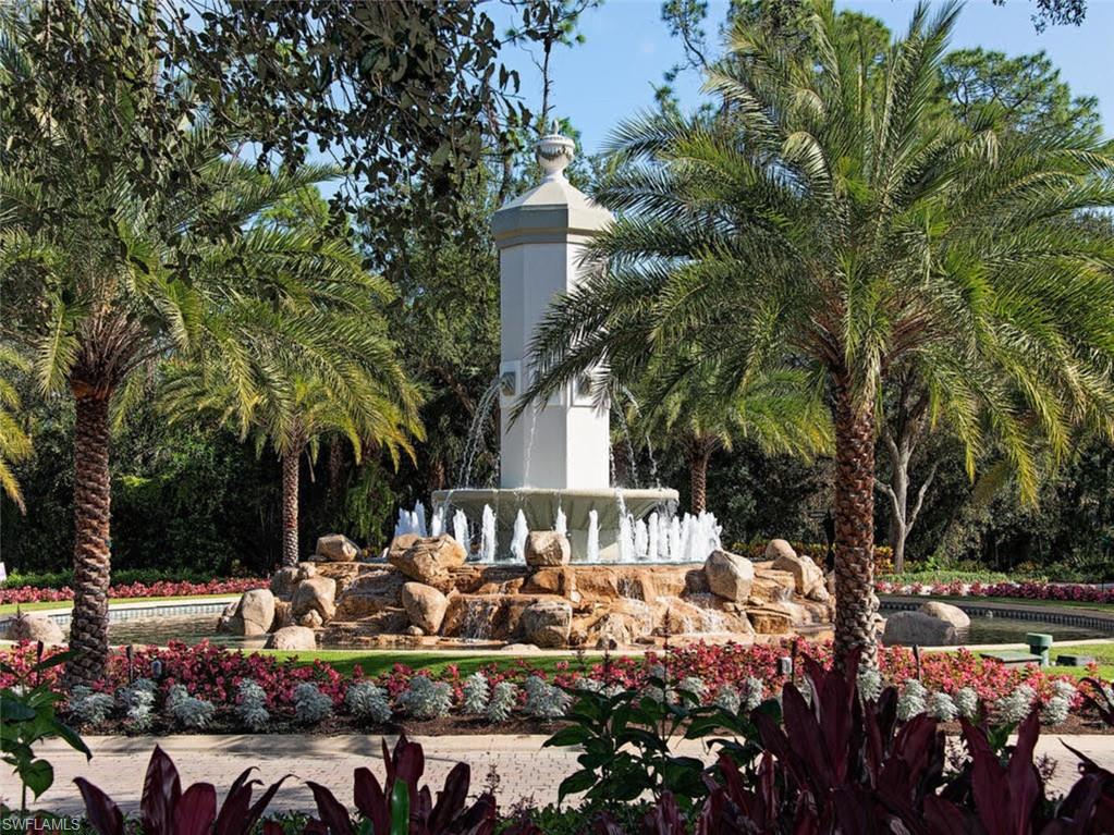 17016 Treviso Way Naples, FL 34110 - Photo 29 of 35 a front view of a house with a yard and tree s