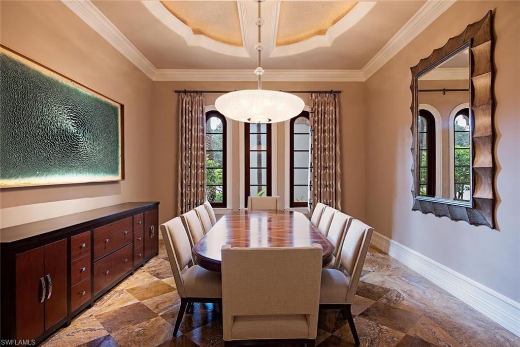 17016 Treviso Way Naples, FL 34110 - Photo 7 of 35 a view of a dining room with furniture window and wooden floor