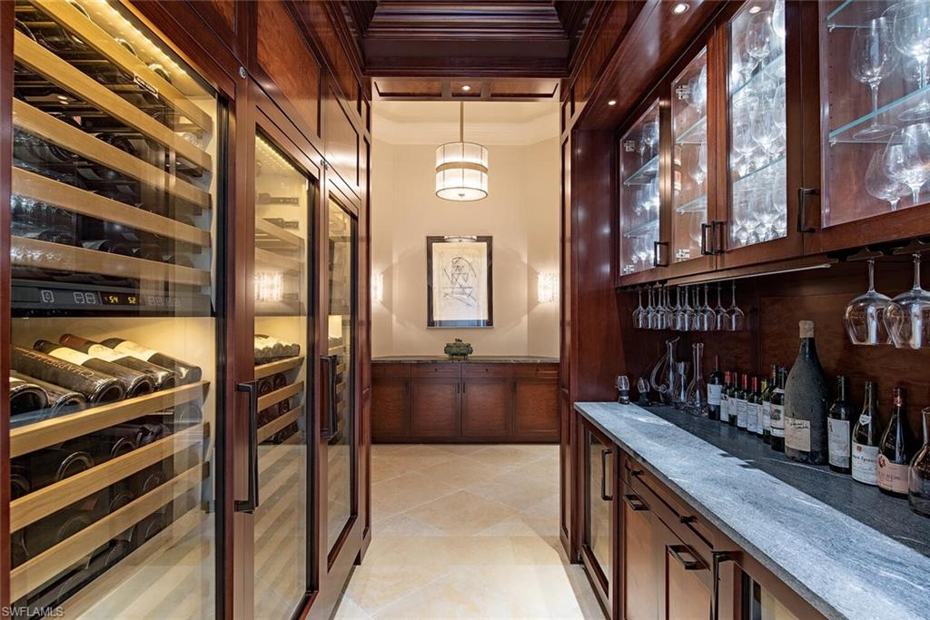 17016 Treviso Way Naples, FL 34110 - Photo 8 of 35 a view of a porch with a bench