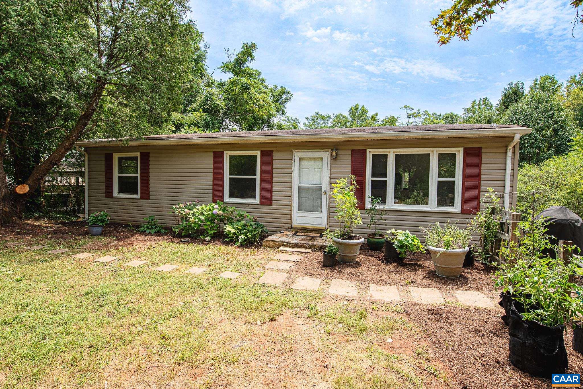 3019 Morgantown Road Ivy, VA 22903 - Photo 2 of 24 a front view of a house with garden