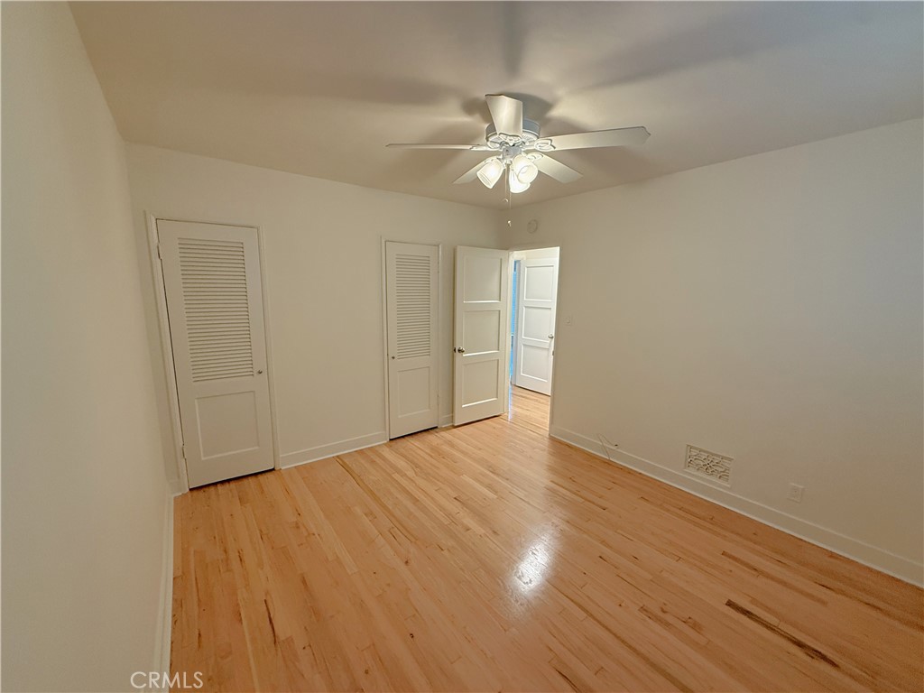 1007 9th Street, Unit 1 Santa Monica, CA 90403 - Photo 14 of 17 a view of an empty room with wooden floor