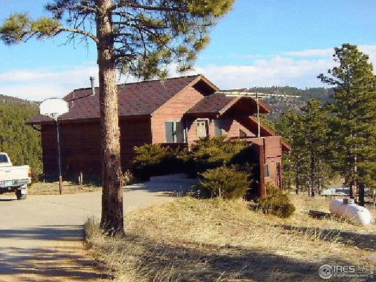 62 Chapman Road Boulder, CO 80302 - Photo 1 of 10 a view of a house with snow on the side of the road