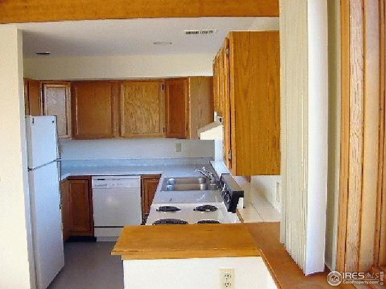 62 Chapman Road Boulder, CO 80302 - Photo 5 of 10 a kitchen with a sink and a refrigerator