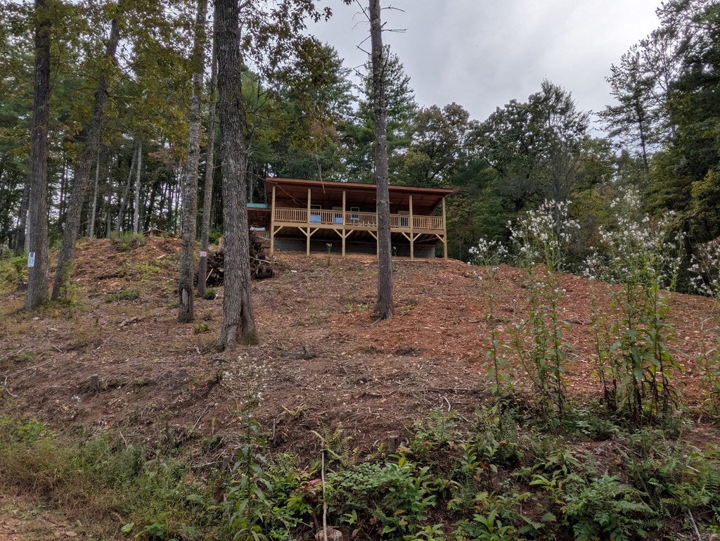 144 Morris Rdg Drive Murphy, NC 28906 - Photo 4 of 11 a view of a backyard with large trees and wooden fence