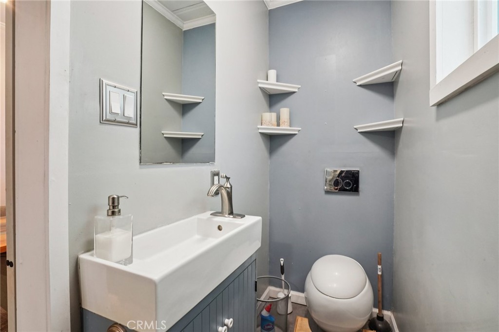 2474 Fir Running Springs, CA 92382 - Photo 10 of 19 a bathroom with a toilet a sink and mirror