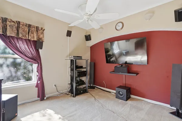 a view of room with a flat screen tv