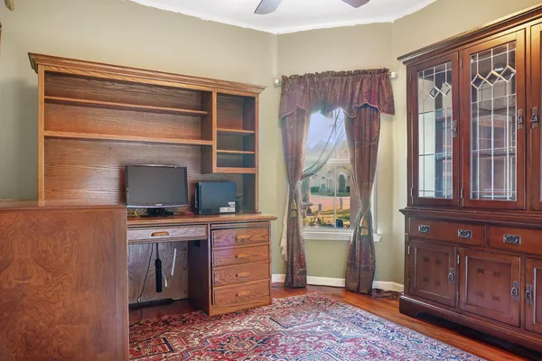 a room with a chair and a fireplace