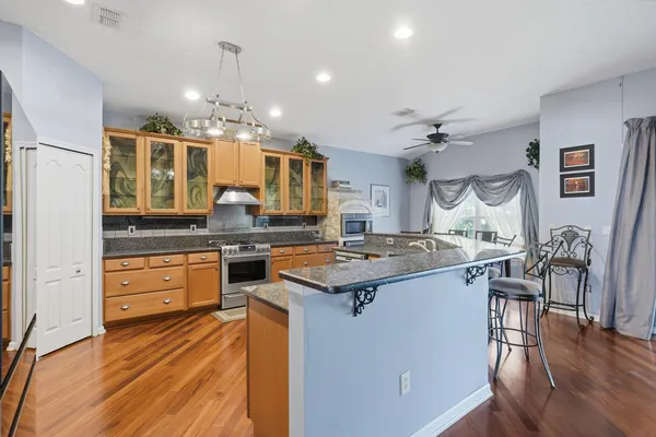 a kitchen with a stove and cabinets