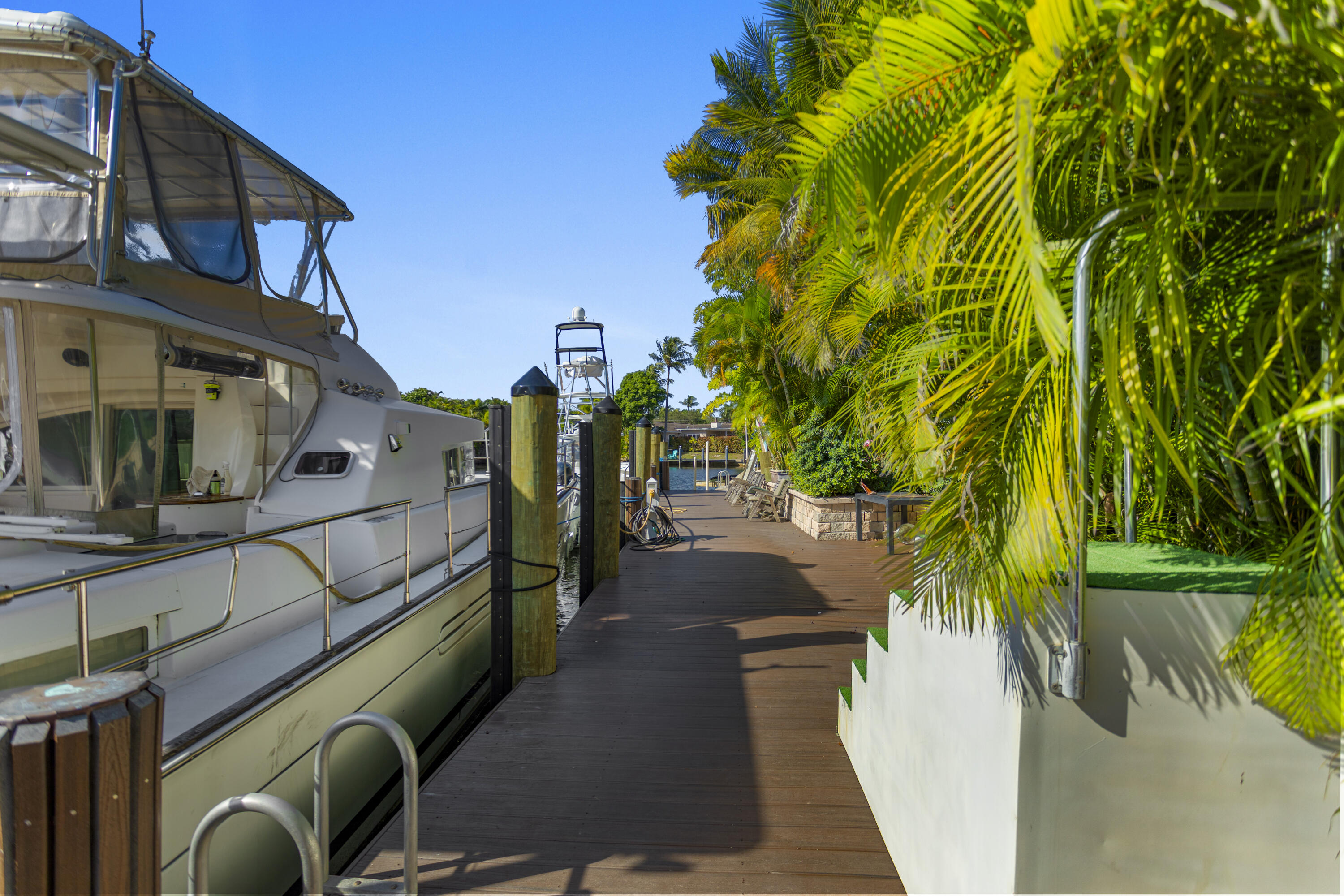2311 Northeast 47th Street Lighthouse Point, FL 33064 - Photo 11 of 40 a view of a house with a yard