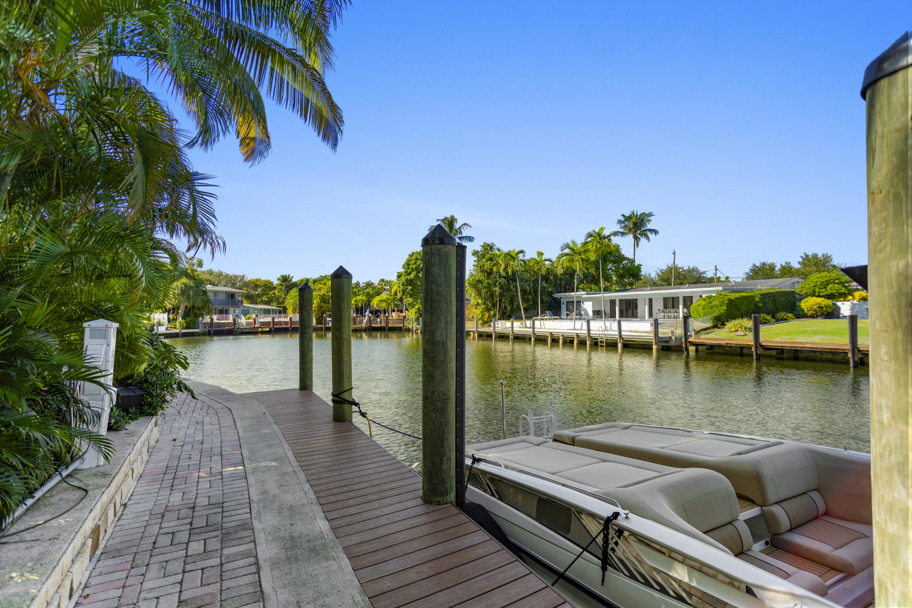 2311 Northeast 47th Street Lighthouse Point, FL 33064 - Photo 13 of 40 a view of a lake with boats and trees in the background