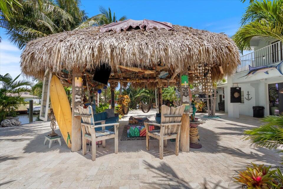 2311 Northeast 47th Street Lighthouse Point, FL 33064 - Photo 17 of 40 a view of a chairs and table in the patio