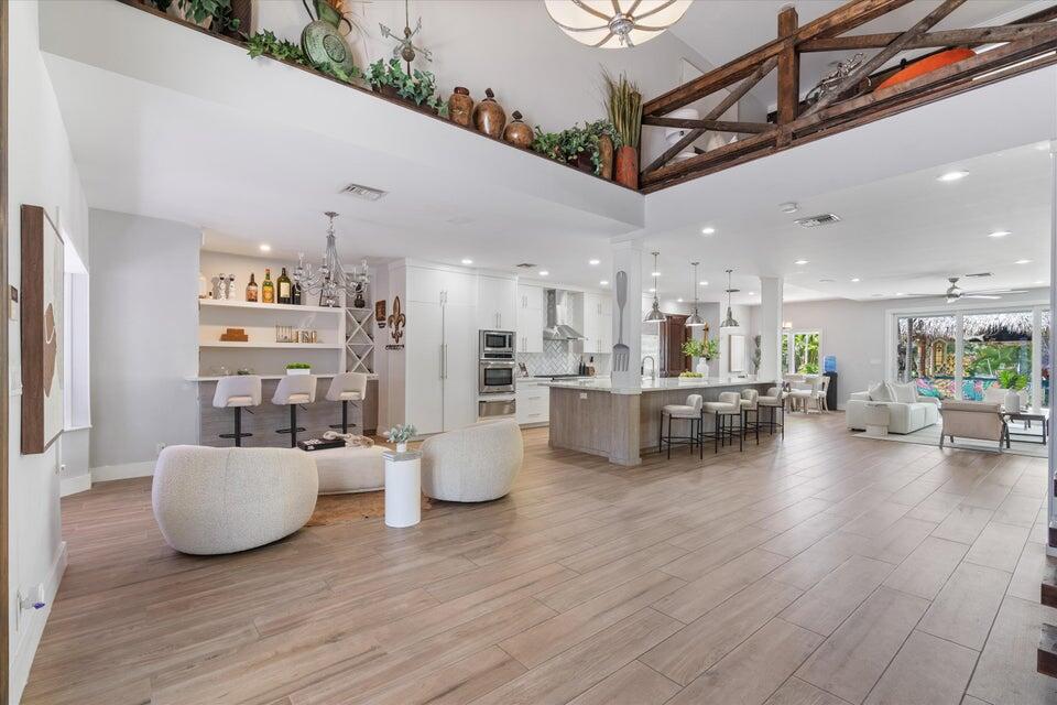 2311 Northeast 47th Street Lighthouse Point, FL 33064 - Photo 18 of 40 a living room with furniture and kitchen view