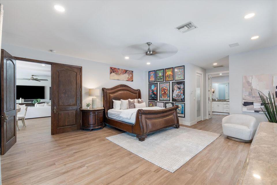 2311 Northeast 47th Street Lighthouse Point, FL 33064 - Photo 24 of 40 a bedroom with furniture and a wooden floor