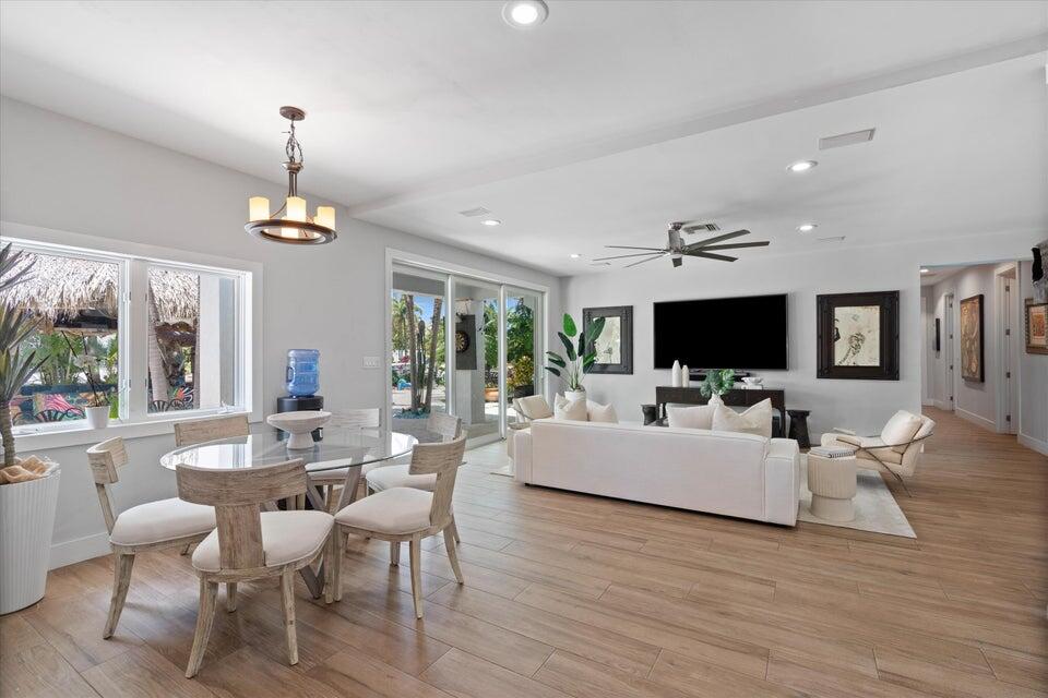 2311 Northeast 47th Street Lighthouse Point, FL 33064 - Photo 38 of 40 a view of a dining room with furniture window and wooden floor