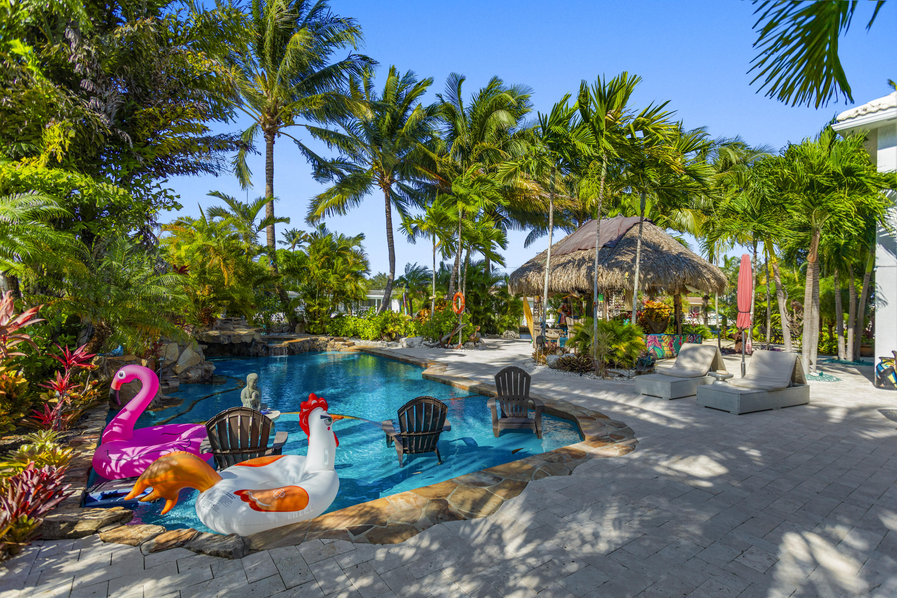2311 Northeast 47th Street Lighthouse Point, FL 33064 - Photo 8 of 40 a view of yard with swimming pool and sitting area