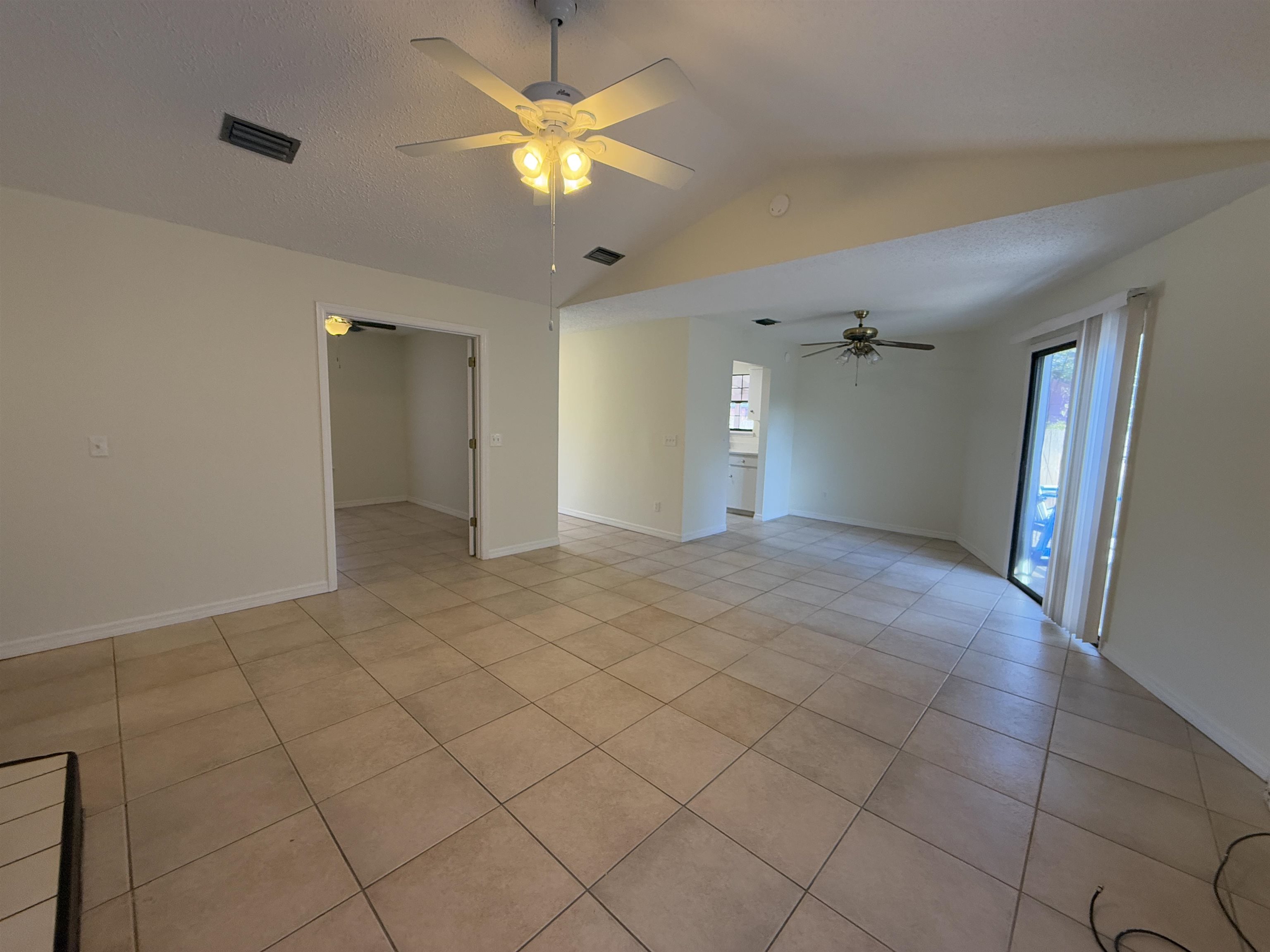 3 Agnes Circle St. Augustine, FL 32080 - Photo 7 of 15 a view of a livingroom with a chandelier fan and windows