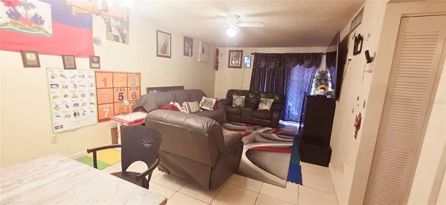 a living room with furniture and a window