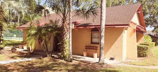 a view of a house with a snow on the road