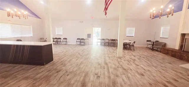 a large room with lots of table and chairs