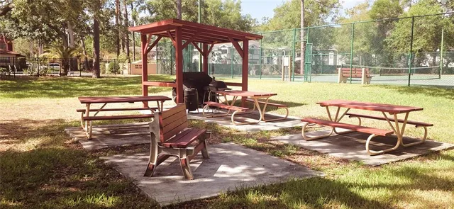 a view of balcony with wooden floor and fence
