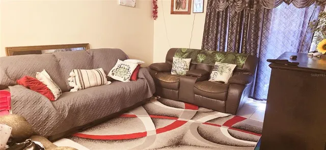 a living room with furniture and a couch