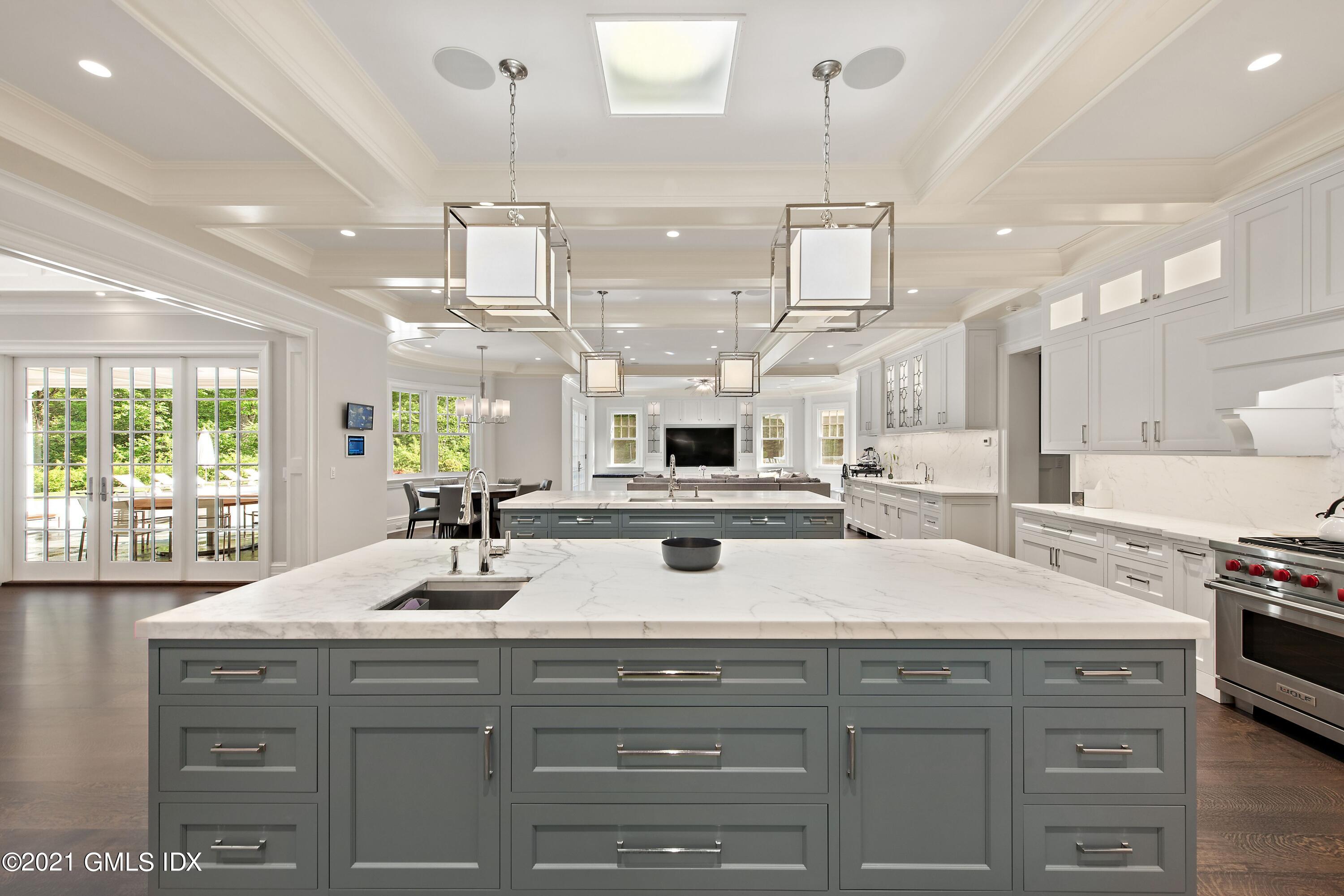 434 Riversville Road Greenwich, CT 06831 - Photo 13 of 47 a kitchen with kitchen island granite countertop a sink a counter space appliances and cabinets