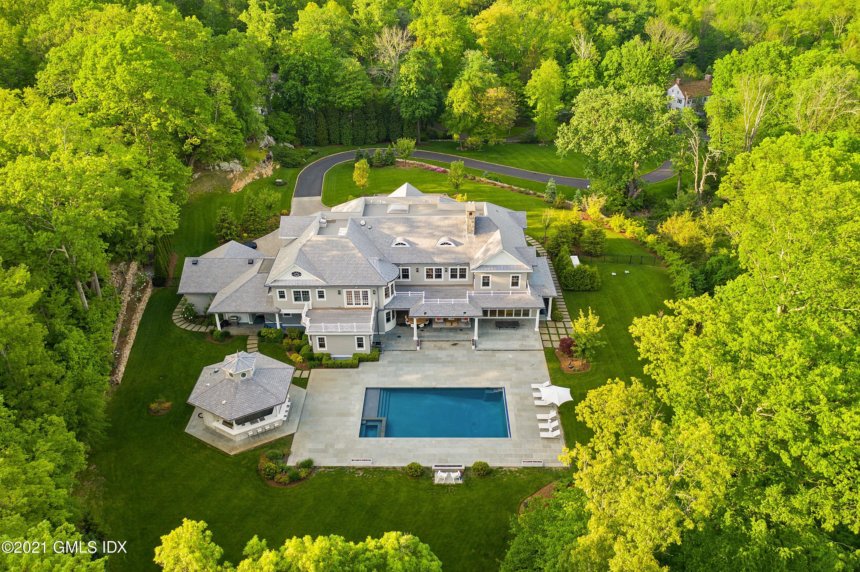 434 Riversville Road Greenwich, CT 06831 - Photo 2 of 47 an aerial view of a house with swimming pool and garden