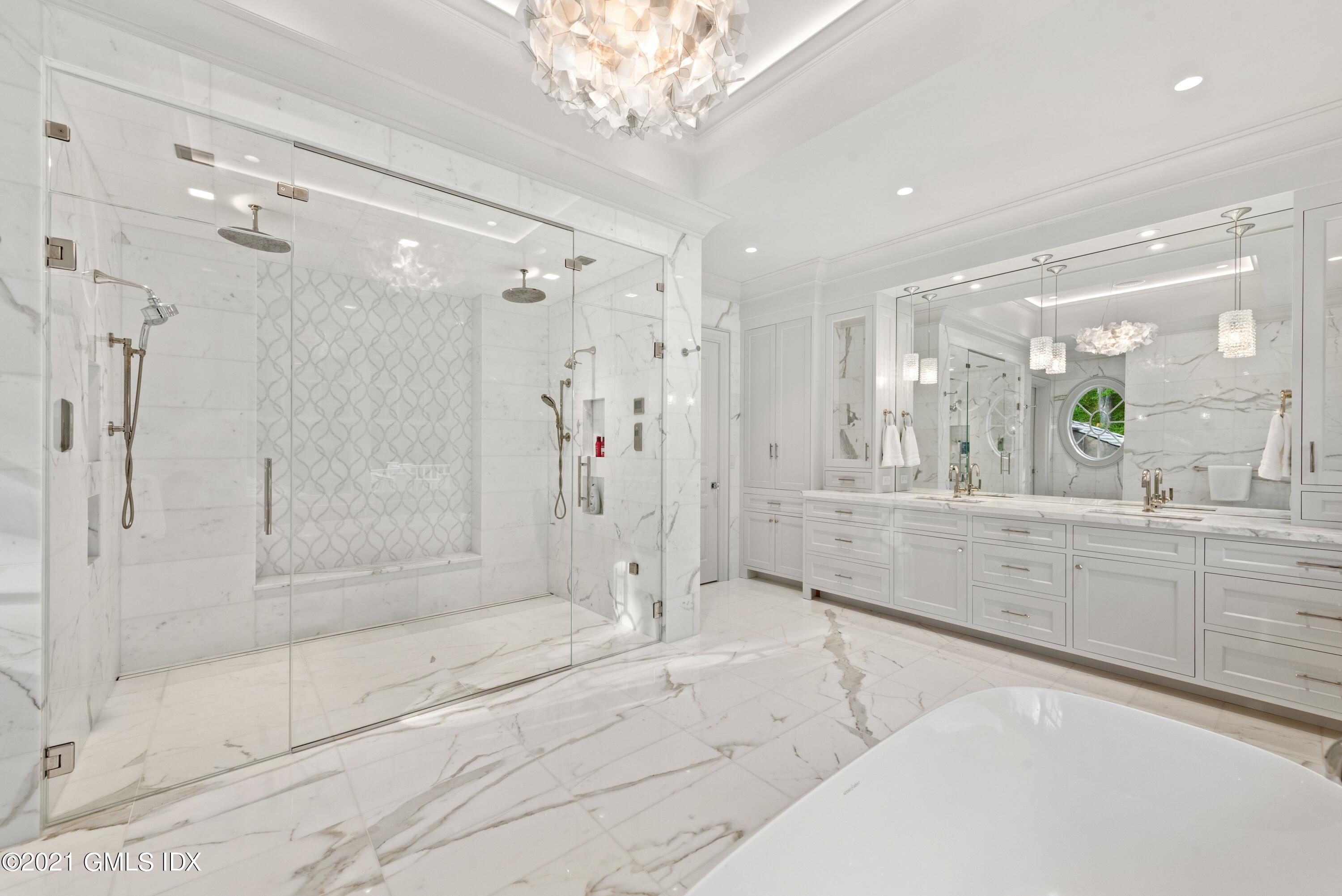 434 Riversville Road Greenwich, CT 06831 - Photo 21 of 47 a bathroom with a shower a sink and a mirror